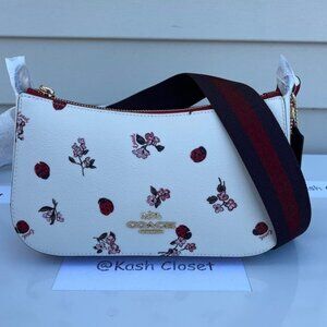 Coach crossbody jes baguette with lady bug floral print chalk multi